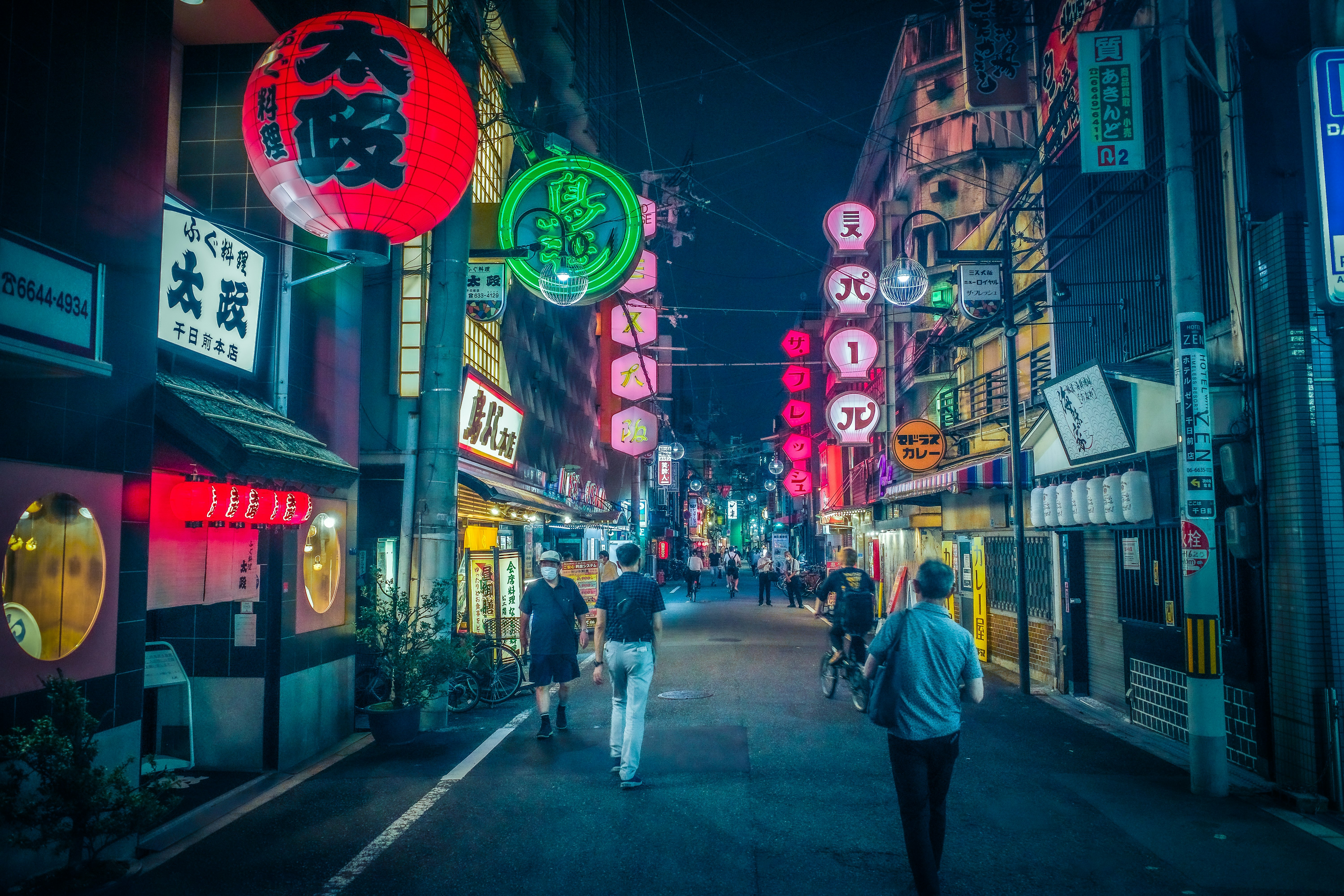 people walking on street during night time